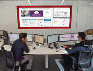 Veolia Experten sitzen vor Bildschirmen mit HUBGRADE Remote Service-Daten