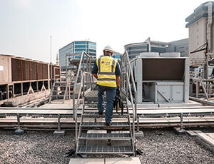 Veolia service engineer on a rooftop